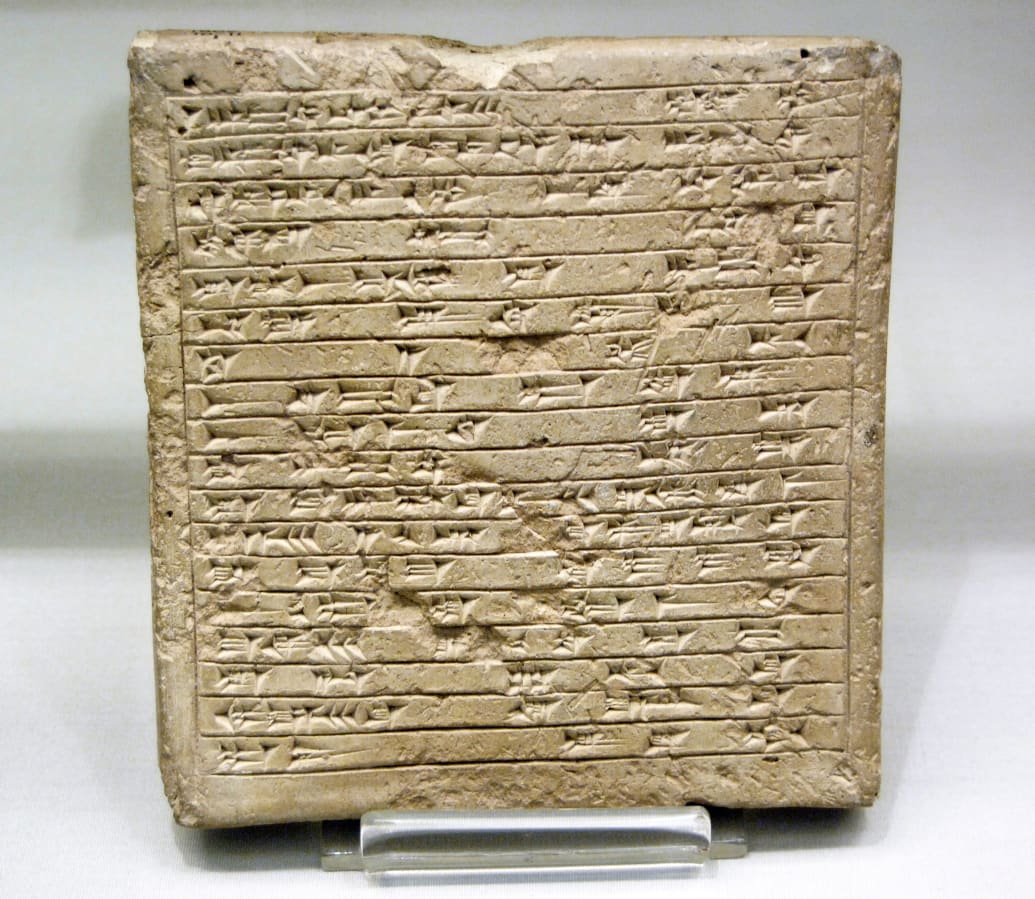 A photograph of an Assyrian 14th century B.C. Commemorative tablet about the construction of a private home. It is Dated between 1360-1330 B.C. Reign of Ashur-uballit I and comes from Assur, Iraq.