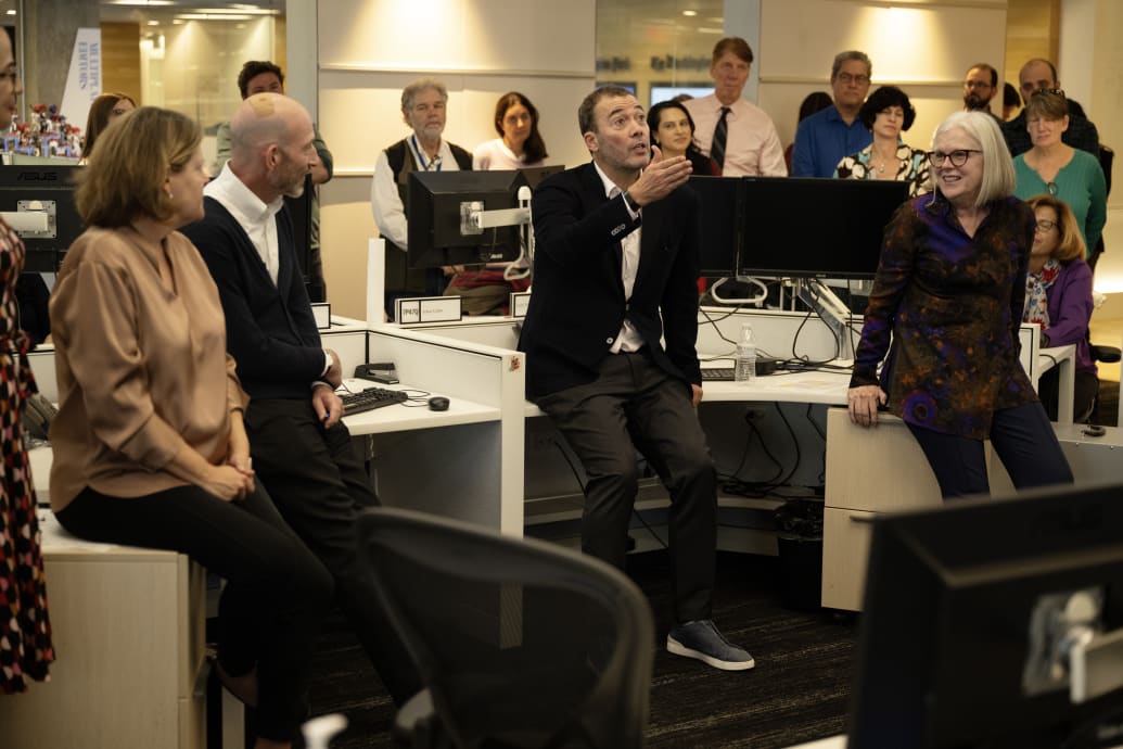Will Lewis wears a pair of $1,100 calfskin-and-suede Zegna sneakers while speaking to staff at The Washington Post.