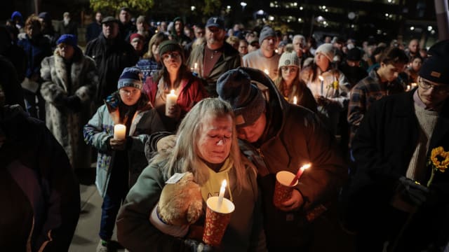 A crowd gathers for a vigil honoring the victims of the Lewiston shootings, in Auburn Maine on Nov. 2, 2023.