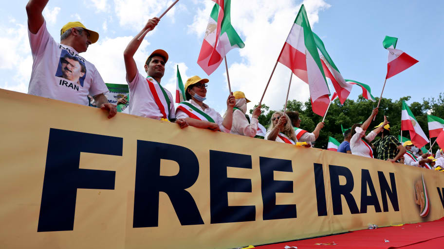 Supporters of the National Council of Resistance of Iran (NCRI) gather to protest against the government in Tehran and the use of the death penalty in Iran