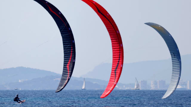 Three Kitefoilers race off the coast of France.