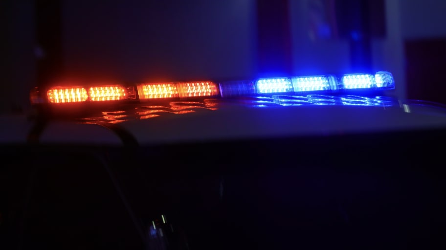 Police car with bright lights and siren