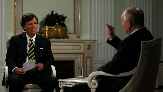 Tucker Carlson looking befuddled during an interview with Vladimir Putin on Feb. 6 in Moscow.