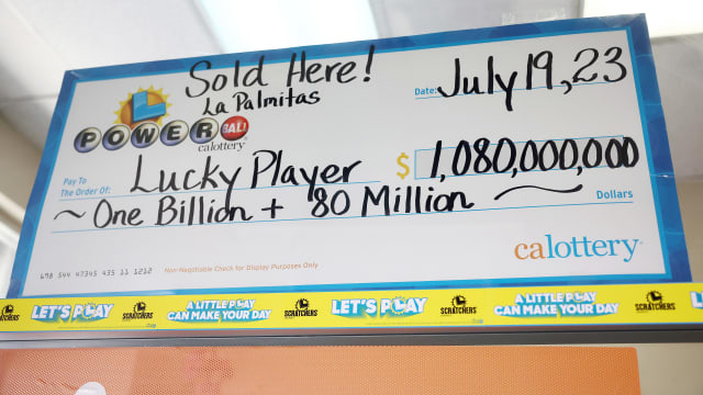 An enlarged symbolic check for $1.08 billion hangs in Las Palmitas Mini Market in Los Angeles, California