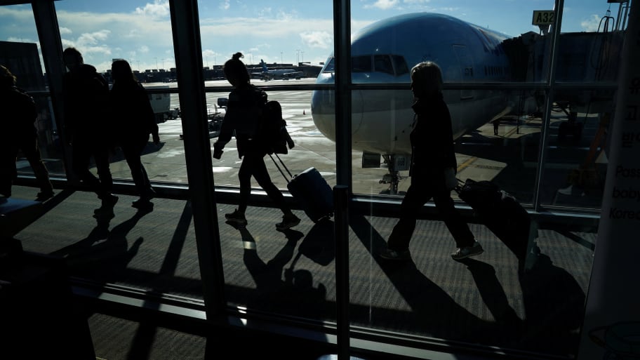 Passengers make their way through the terminal at Washington Dulles International Airport. 