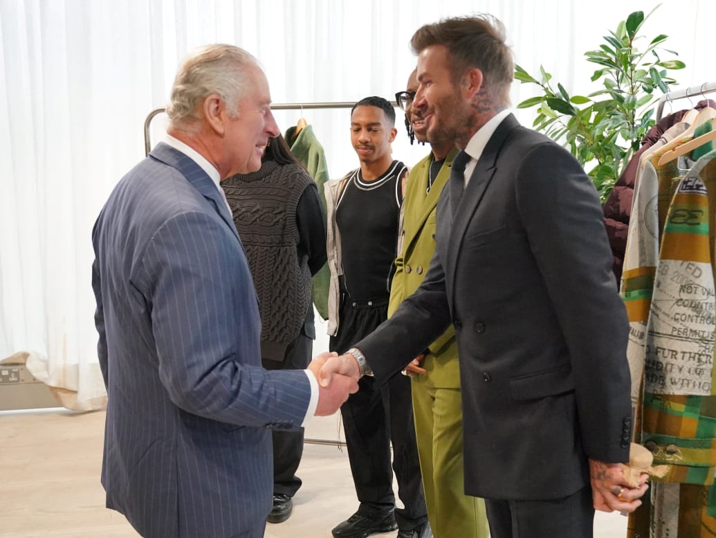 King Charles III shakes the hand of David Beckham during a special industry showcase event hosted by the British Fashion Council (BFC) at 180 Studios, London, May 18, 2023.