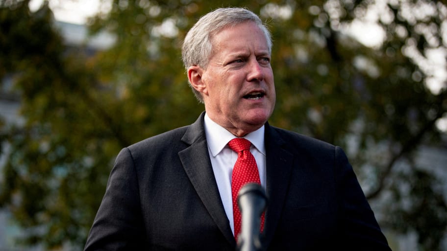 Mark Meadows speaks to reporters following a television interview outside the White House.