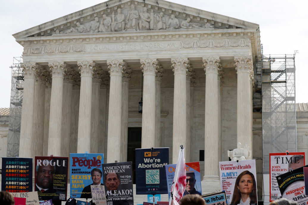 Demonstrators rally outside the U.S. Supreme Court as justices hear oral arguments in a bid by President Joe Biden's administration to preserve broad access to the abortion pill, in Washington, U.S., March 26, 2024.