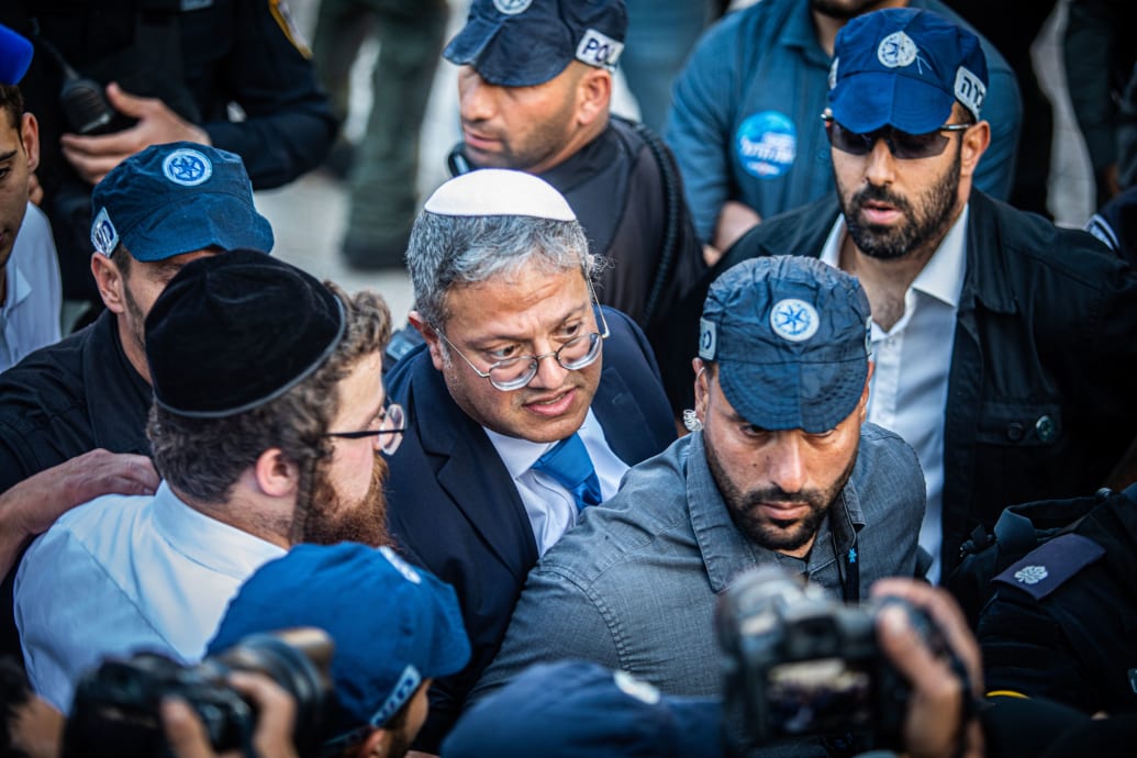 A photograph of Israeli minister of National Security Itamar Ben-Gvir surrounded by body guards at Damascus gate in Jerusalem.