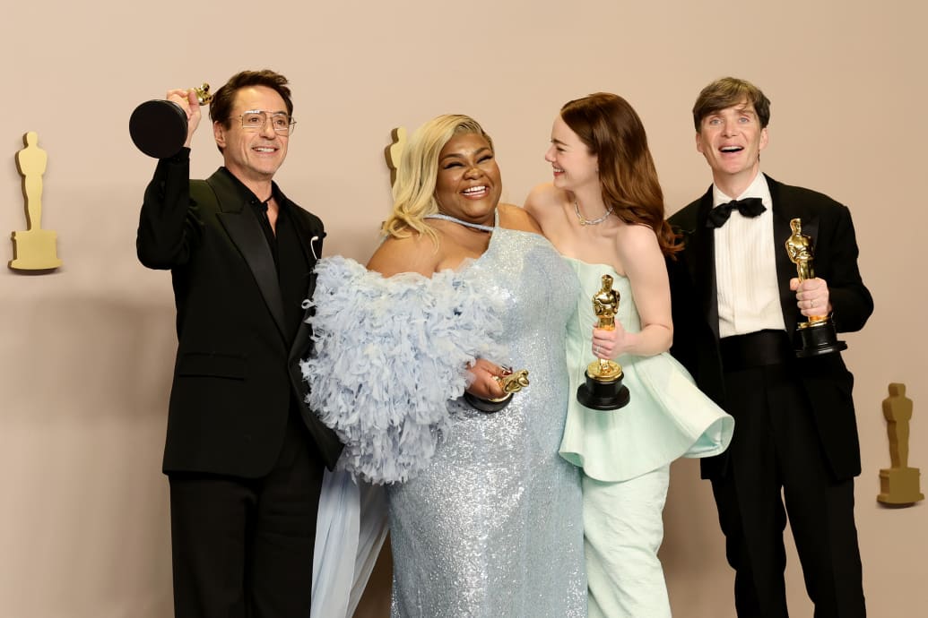 Robert Downey Jr., Da’Vine Joy Randolph, Emma Stone, and Cillian Murphy hold their Oscars.