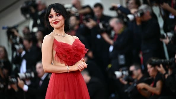 Jenna Ortega walks the red carpet of the opening film "Beetlejuice Beetlejuice" at the Venice Film Festival, Aug. 28, 2024.