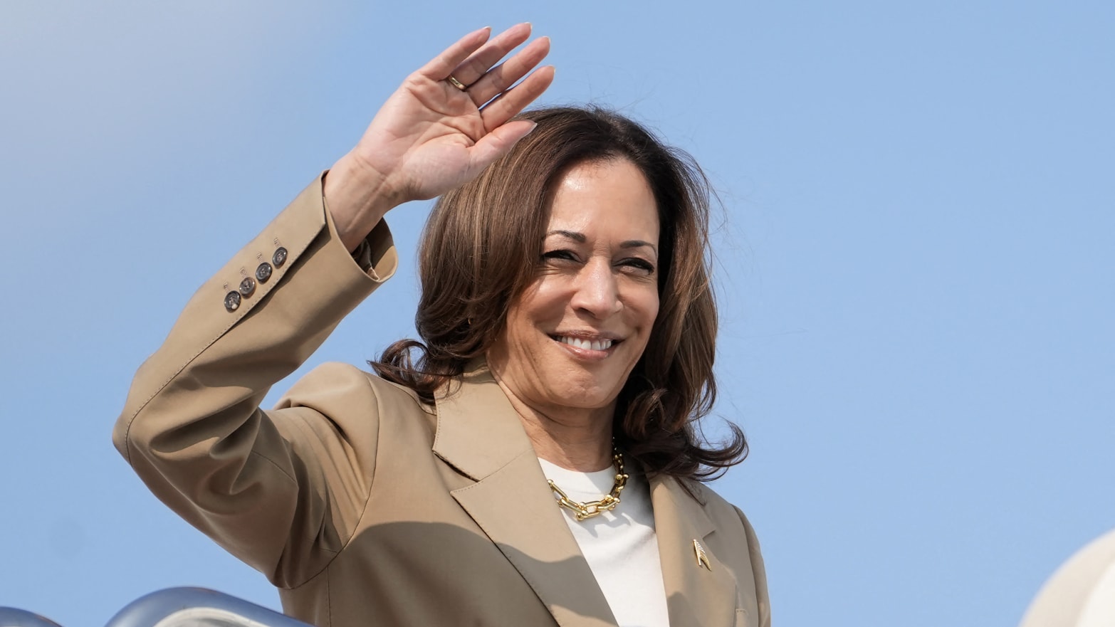 Harris waves as she returns to Washington.