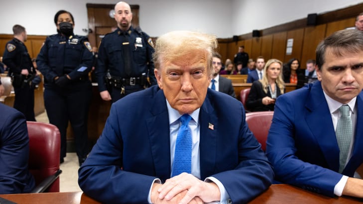 Former president Donald Trump sits in the courtroom during his hush-money trial.