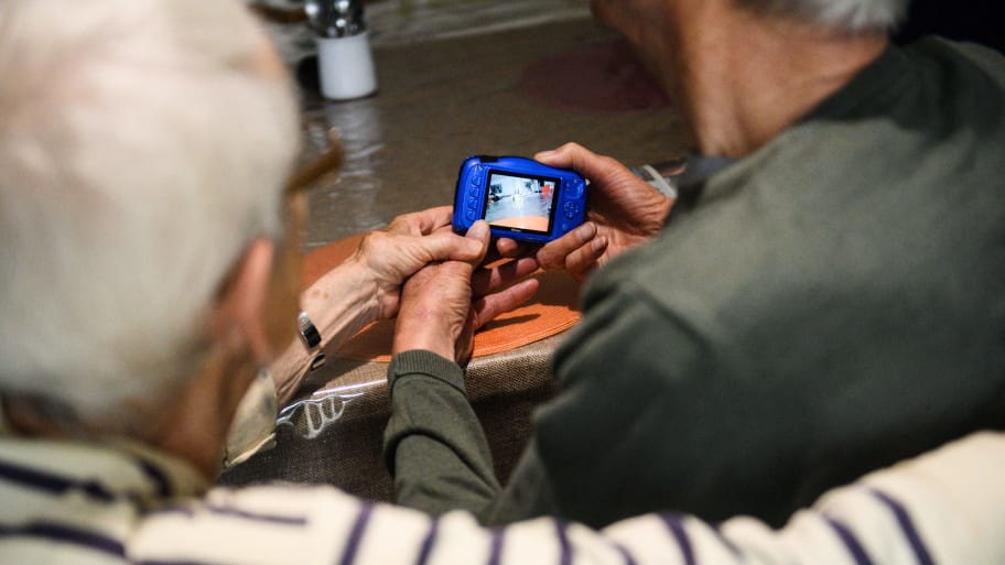 Elderly Alzheimer's patients take part in a photography workshop aimed at stimulating their interactivity in France.