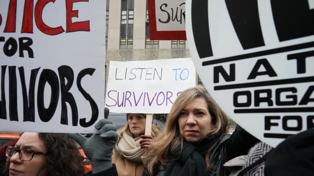 Survivors of sexual abuse gather outside the courthouse before the arrival of Harvey Weinstein at the State Supreme Court in Manhattan January 6, 2020 on the first day of his criminal trial on charges of rape and sexual assault in New York City. 
