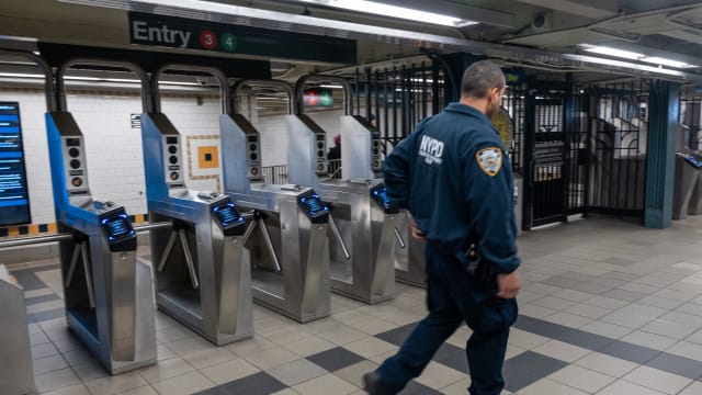 NYPD officers patrol a Brooklyn subway station on March 18, 2024 in New York City.