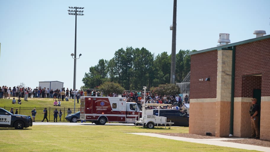 Students wait to be picked up by their parents after a shooting at Apalachee High School