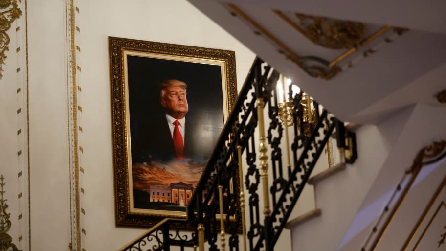A portrait of former President Donald Trump over the White House is seen on a stairway of his Mar-a-Lago estate.