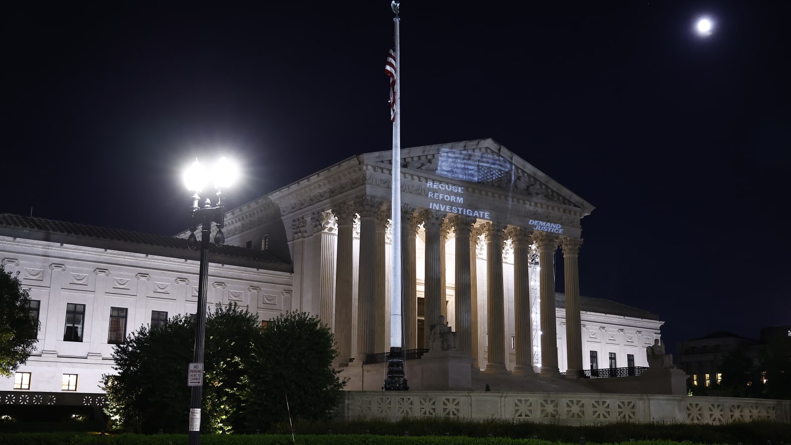 Demand Justice projects \"Stop The Steal\" upside down American flag on the U.S. Supreme Court to call attention to Justice Alito's alleged actions on May 21, 2024 in Washington, DC. 