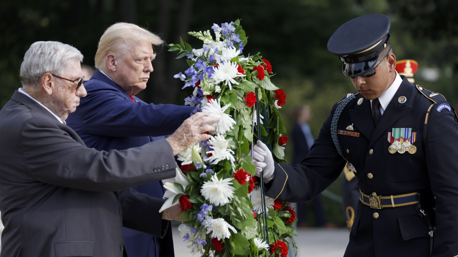 Former U.S. President Donald Trump stands during a wreath laying ceremony at Arlington National Cemetery on Aug. 26, 2024.