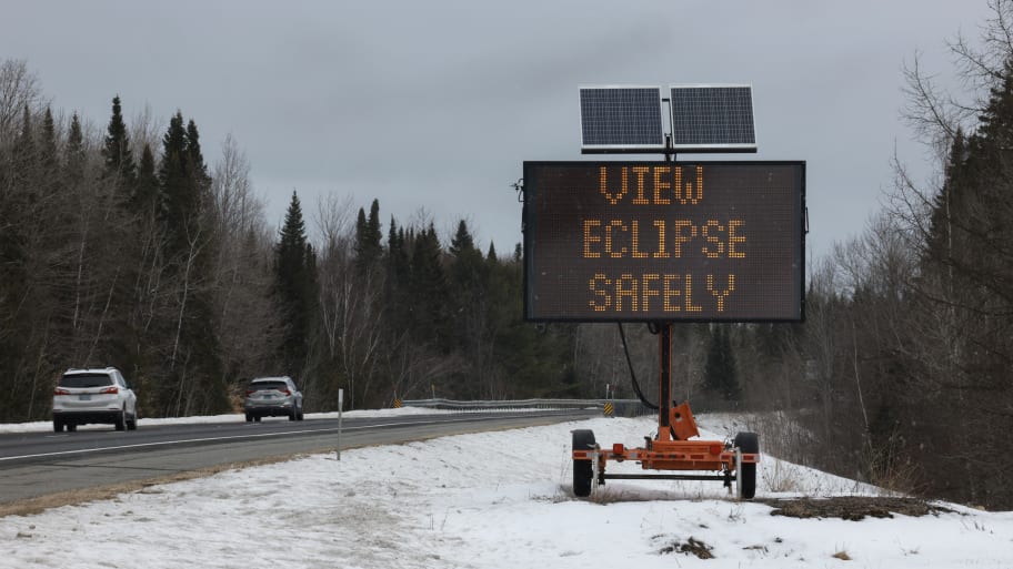 A sign placed along I-95 encourages people to view the upcoming eclipse safely on April 07, 2024 in Houlton, Maine.