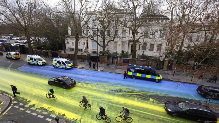 Protest group 'Led by Donkeys' spread paint in the colors of the Ukrainian flag on the road, ahead of the first anniversary of Russia's invasion of Ukraine, outside the Russian Embassy in London, Britain February 23, 2023. 
