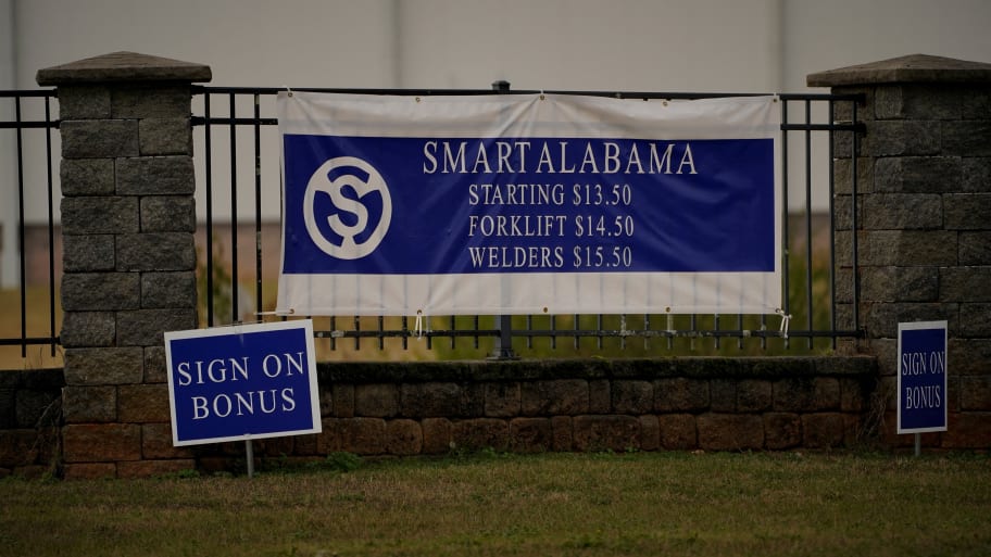 Signs advertise wages and bonuses in front of the SMART Alabama manufacturing facility in Luverne, Alabama, U.S., December 4, 2022. 