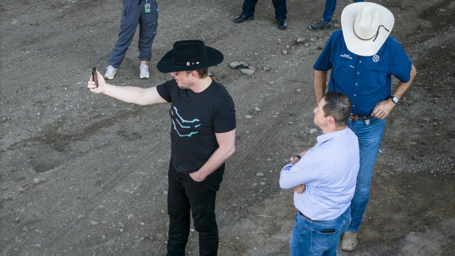Elon Musk, wearing a black Stetson hat, livestreaming while visiting the Texas-Mexico border