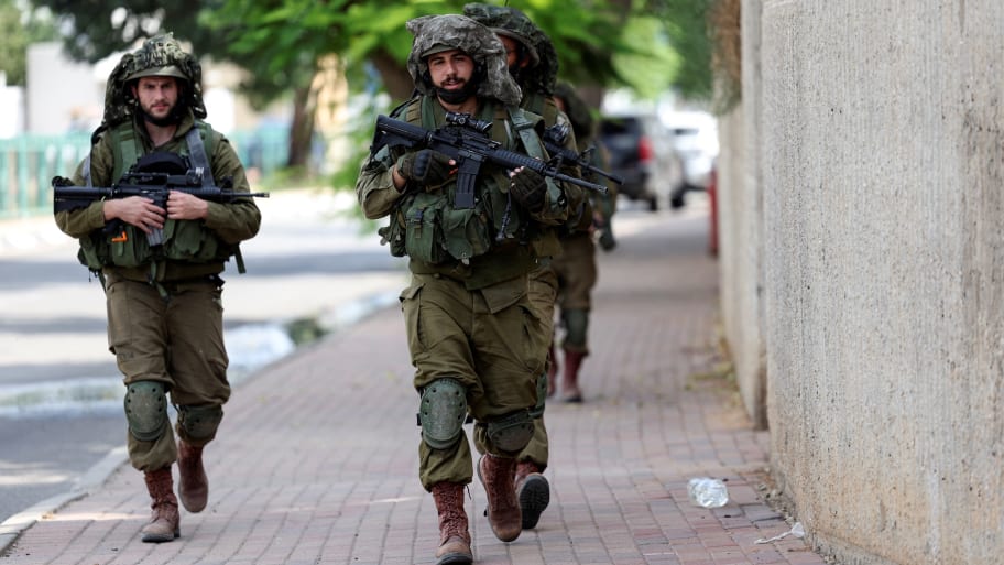 Israeli soldiers patrol following a mass-infiltration by Hamas gunmen from the Gaza Strip, in Sderot, in southern Israel, October 11, 2023. 