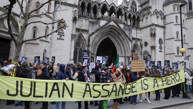 WikiLeaks founder Julian Assange’s supporters stand outside the High Court on Feb. 20, when he was too sick to attend a hearing.