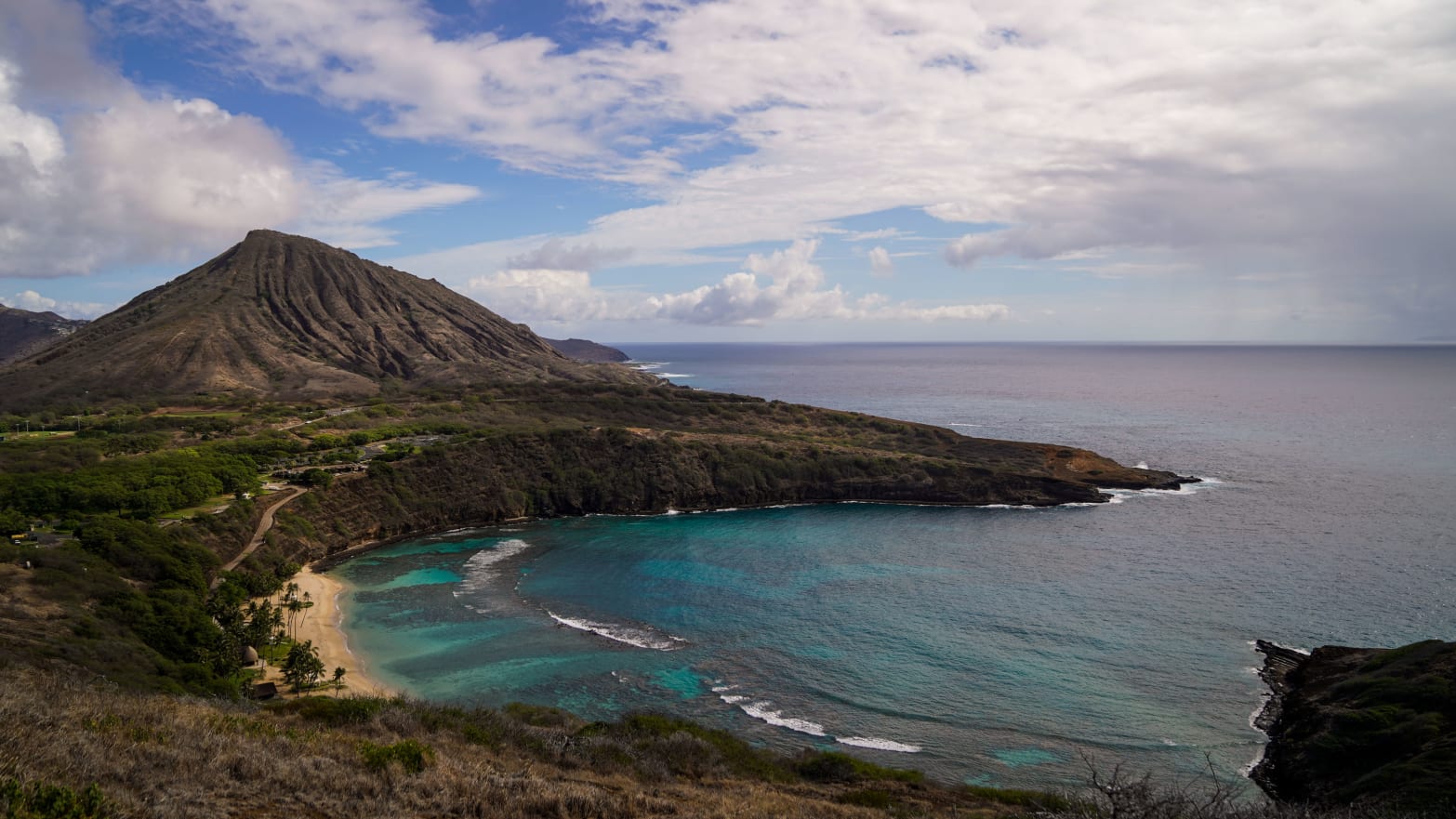 A view of Hanauma Bay with Koko Head in the background from a hiking trail overlooking the popular Nature Preserve