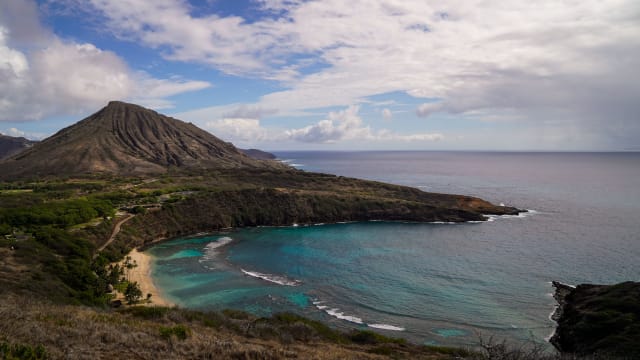 A view of Hanauma Bay with Koko Head in the background from a hiking trail overlooking the popular Nature Preserve