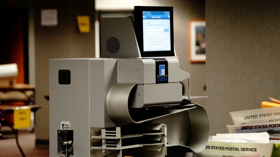 An ESS (Elections Systems & Software) DS850 high-speed central scanner and vote tabulator is seen at Milwaukee Central Count as absentee ballots are counted the night of Election Day in Milwaukee, Wisconsin, U.S., November 3, 2020.