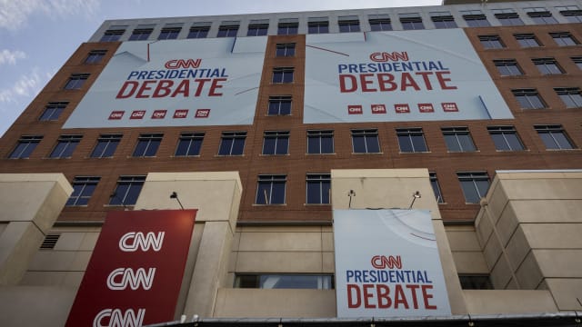 Banners are placed outside of CNN studios ahead of the first presidential debate in Atlanta, Georgia on June 24, 2024.