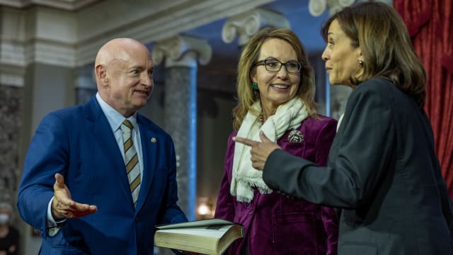 Vice President Kamala Harris prepares to swears in Sen. Mark Kelly (D-AZ) with his wife Gabrielle Giffords in the old senate chamber for the Ceremonial Swearing on January 03, 2023 in Washington, DC. 