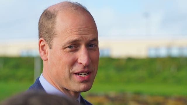 Prince William speaks at an outdoor event