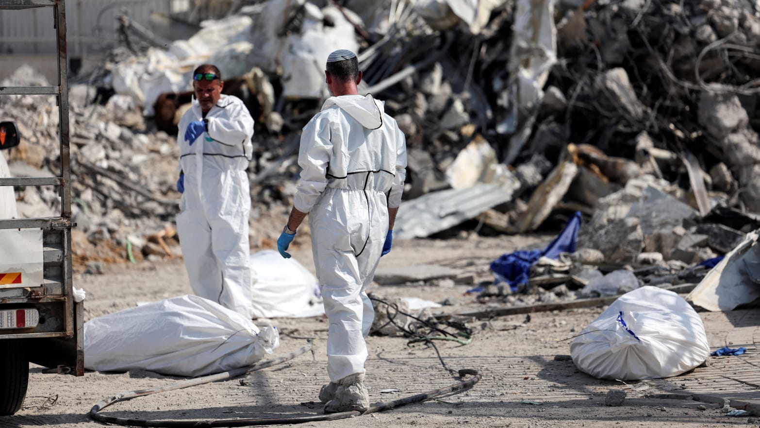 Israeli rescue workers remove dead bodies after a Hamas surprise attack on Oct. 7.