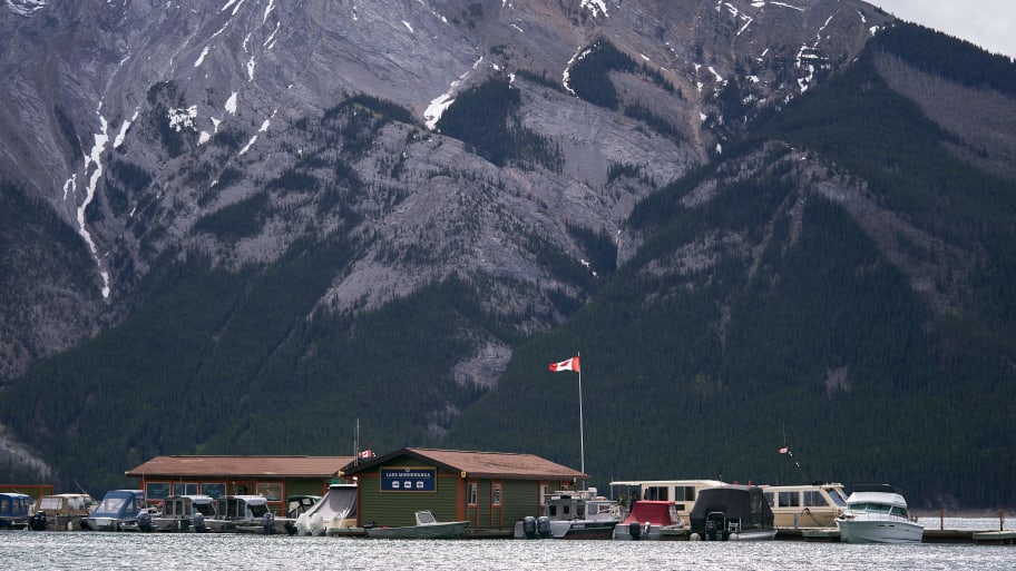 A grizzly bear at Canada's Banff Park left two dead, Canada Parks says.