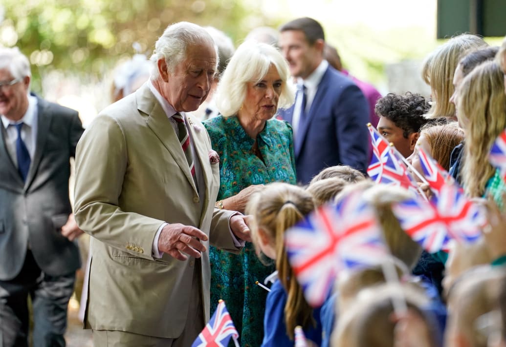 King Charles and Queen Camilla meet local school children as they arrive at Brecon Cathedral, Wales, Britain, July 20, 2023.