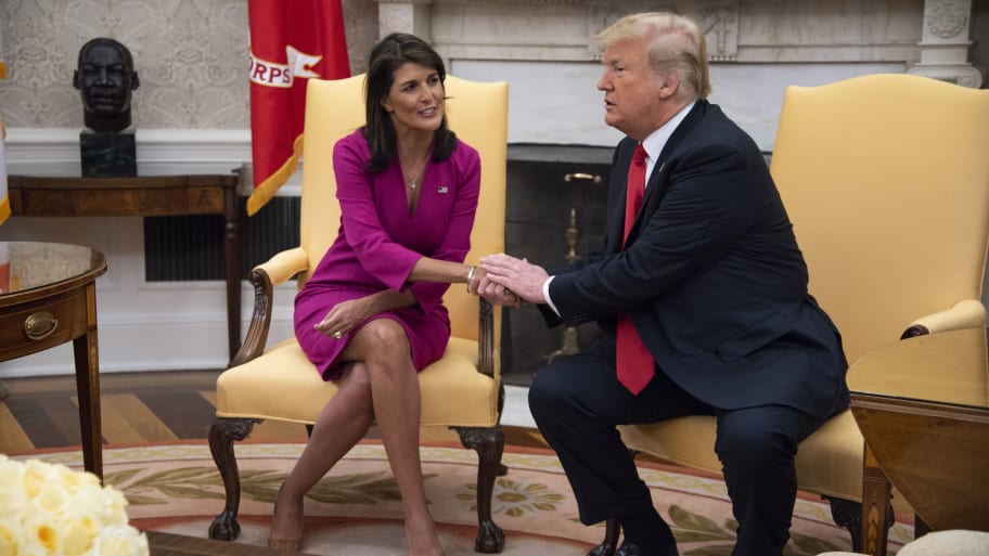 Nikki Haley, United States Ambassador to the United Nations, shakes hands with President Donald Trump.