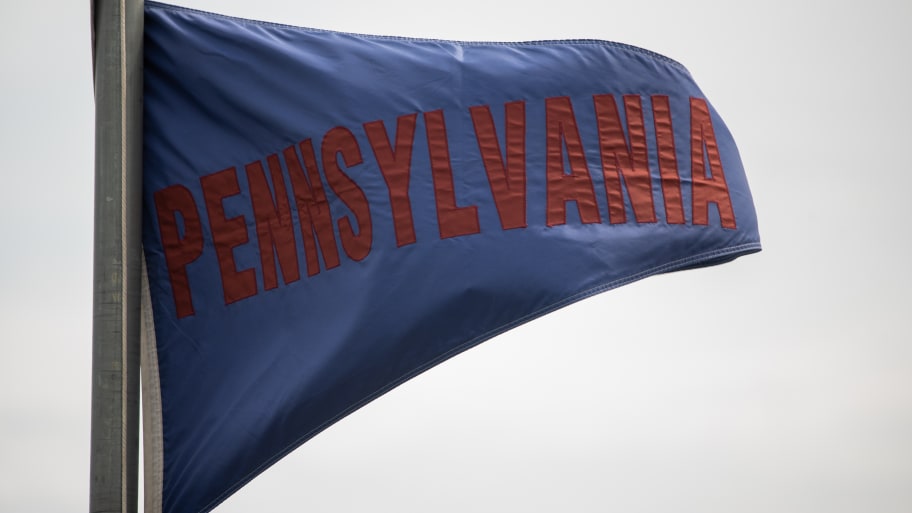A University of Pennsylvania Quakers flag waves in the wind