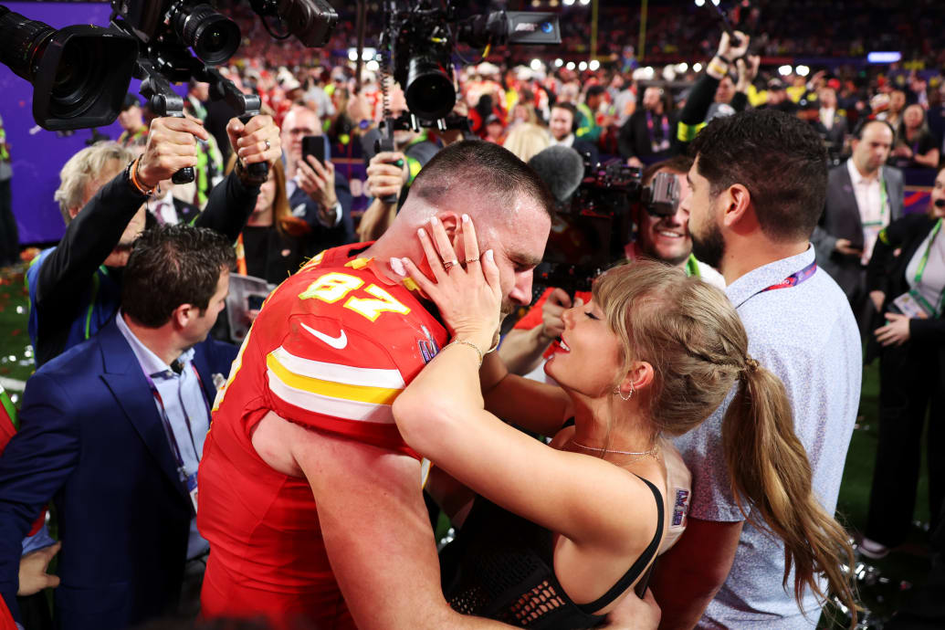 Travis Kelce and Taylor Swift celebrating at the Super Bowl