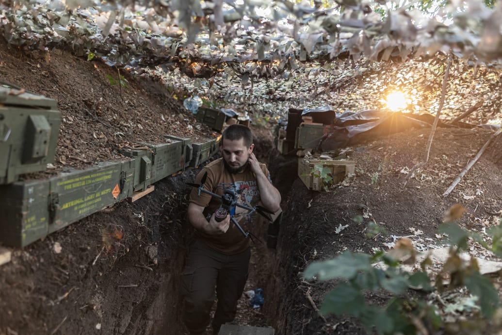 Ukrainian soldier carries a drone in a trench in the direction of Bakhmut as the Russia-Ukraine war continues in the Donetsk Oblast, Ukraine on August 10, 2024. 