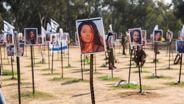 Photos of people killed or kidnapped during the Hamas attack on the Super Nova festival on October 7th are displayed in a temporary memorial site on January 04, 2024 in Re'im, Israel. 