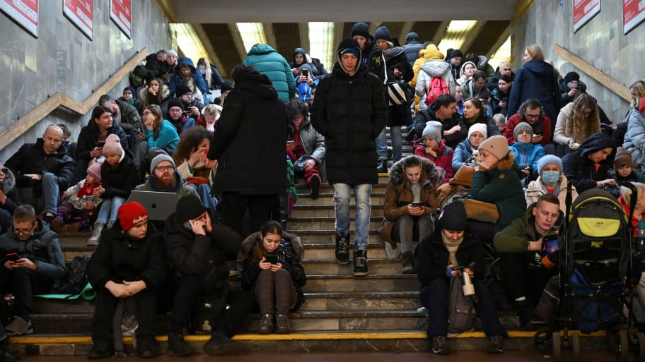 People take shelter inside a metro station during massive Russian missile attacks in Kyiv.