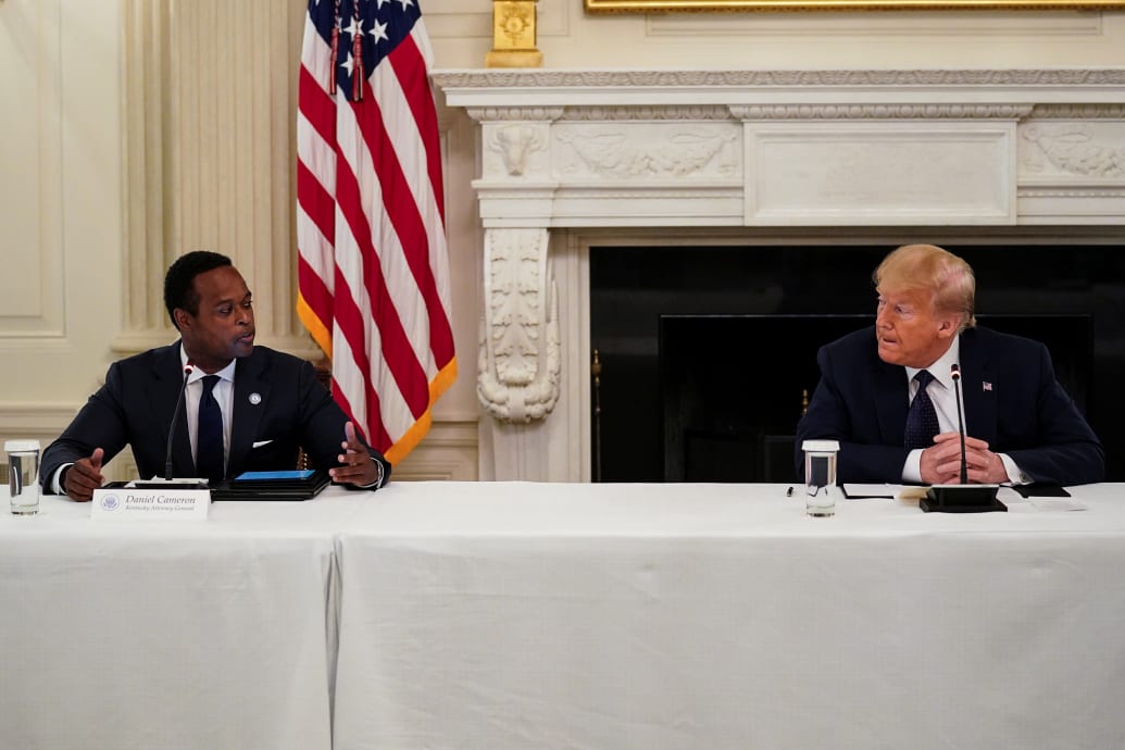 President Donald Trump listens to Kentucky Attorney General Daniel Cameron during a roundtable discussion with law enforcement