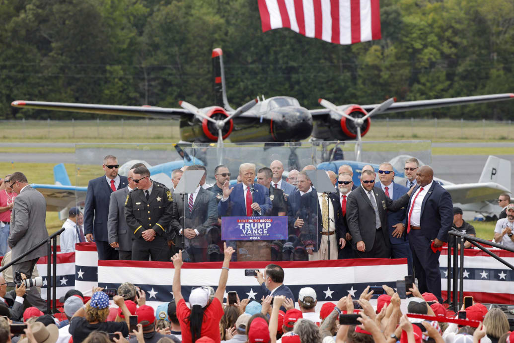 North Carolina Lt. Gov. Mark Robinson, far right, appears on stage as former U.S. President Donald Trump speaks at the North Carolina Aviation Museum & Hall of Fame in Asheboro last month.