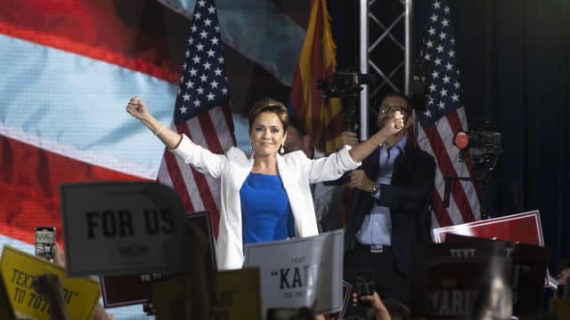 Kari Lake takes the stage to announce her bid for the seat of U.S. Sen. Kyrsten Sinema (I-AZ) on October 10, 2023 in Scottsdale, Arizona.