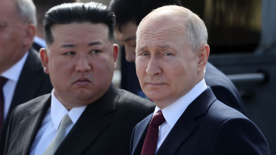 Russian President Vladimir Putin (R) and North Korean leader Kim Jong-un (L) visit a construction site of the Angara rocket launch complex on Sept. 13, 2023, in Tsiolkovsky, Russia.
