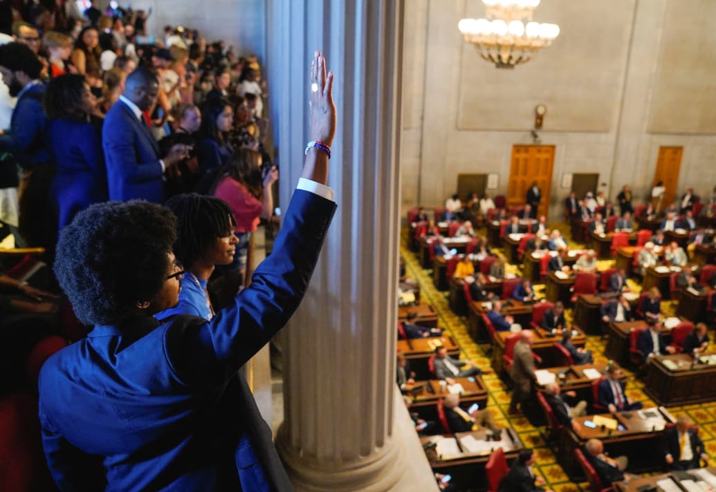 Justin Pearson waves from the house gallery after Representative Jones returned to the house floor after his reinstatement